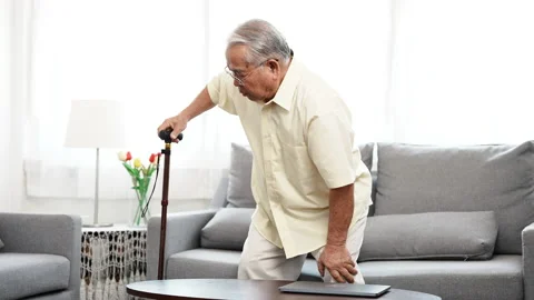 Asian Eldery senior man feeling pain in knee and standing up step walking Stock Footage 148060561