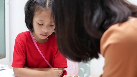 An Asian elementary school girl is studying in the classroom Stock Footage 125636233