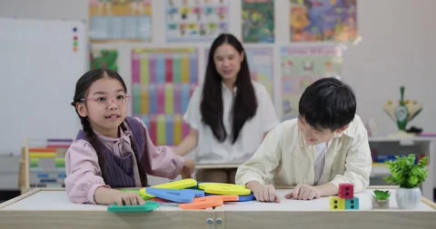 Asian Elementary Students Playing with Large Foam Numbers in Classroom Stock Footage 334172119