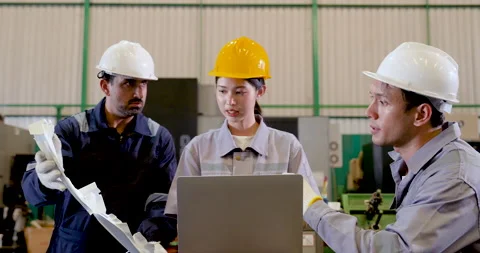 Asian engineer group discusses molded component across laptop workstation, Stock Footage 335115486