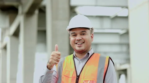 Asian engineer handsome man or architect looking construction with white safety  Stock Footage 162288176