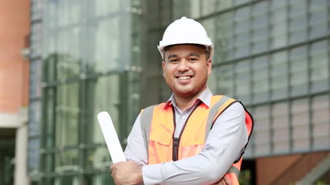 Asian engineer handsome man or architect looking forward holding paperwork bluep Stock Footage 162292513