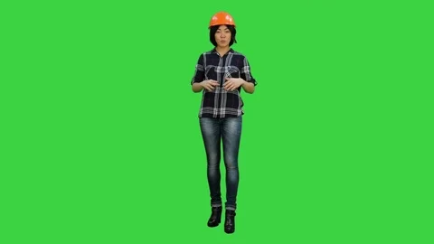 Asian engineer with helmet talk to a camera on a Green Screen, Chroma Key 動画素材 78007537