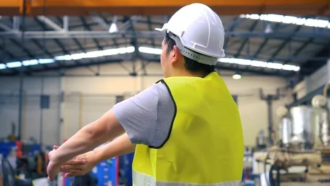 Asian engineer stretching body during break Stock Footage 107881235