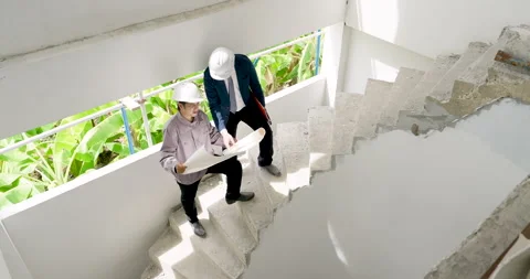 Asian engineer team works on unfinished stair inspection, male supervisor Stock Footage 338222083