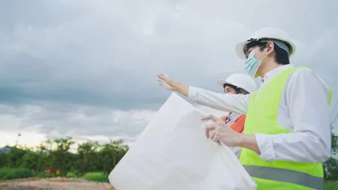 Asian Engineer teamwork at construction site, complex expertise working field Stock Footage 156885103