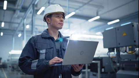 Asian Engineer Using Laptop Computer in Factory Stock Footage 282879388