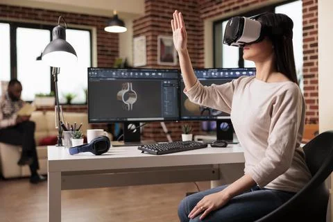Asian engineer with vr headset developing product Stock Photos