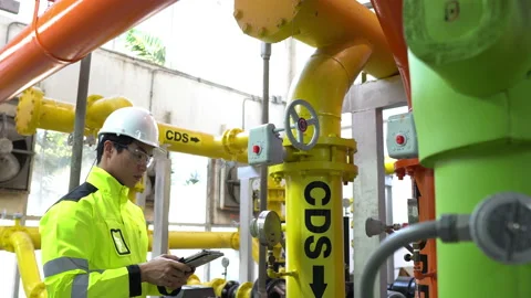 Asian engineer wearing glasses working in the boiler room Stock Footage 196941853