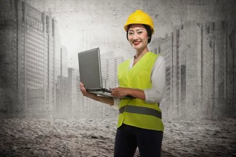 Asian engineer working with laptop Stock Photos