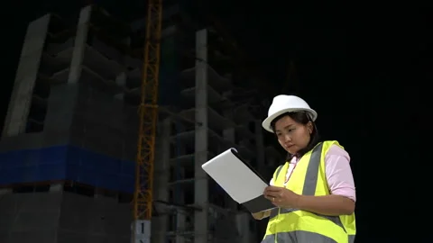 Asian engineer working overtime at night Stock Footage 133734691