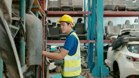 Asian Engineering man is working in heavy industrial plant Engine parts facto Video stock 152832443