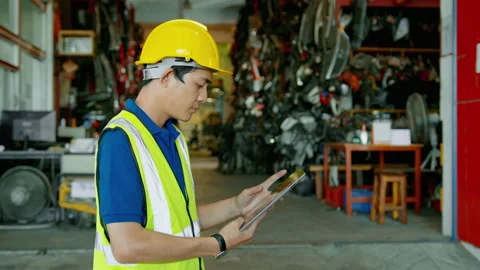 Asian Engineering man is working in heavy industrial plant Engine parts facto Video stock 152832518