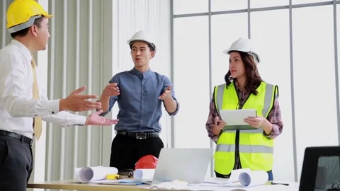 Asian engineering team on the project construction blueprint in meeting room. Stock Footage 171257705