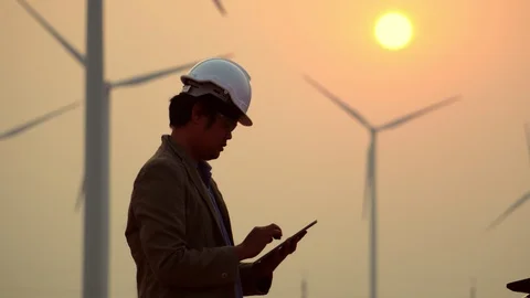 Asian engineers are checking the wind turbine system with a tablet Stock Footage 105463959