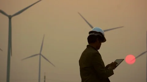 Asian engineers are checking the wind turbine system with a tablet 스톡 동영상 105468650
