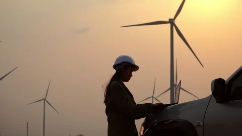 Asian engineers are checking the wind turbine system with a tablet Stock Footage 105472698