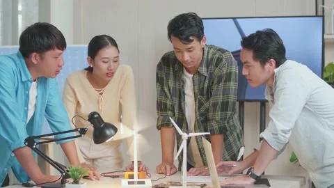 Asian Engineers Group Testing The Wind Turbine While Having A Meeting Stock Footage 201338707