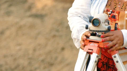 Asian Engineers use tacheometer or theodolite for the construction of buildings. Stock Footage 102226027
