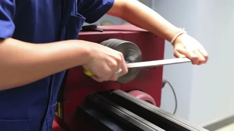 Asian factory worker using file to smooth up the metal part in factory. Stock Footage 158666168