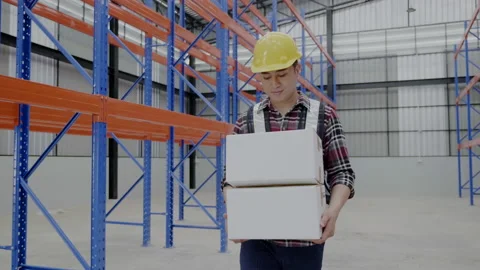 Asian Factory worker in warehouse work to move cartons to customers Stock Footage 154592171