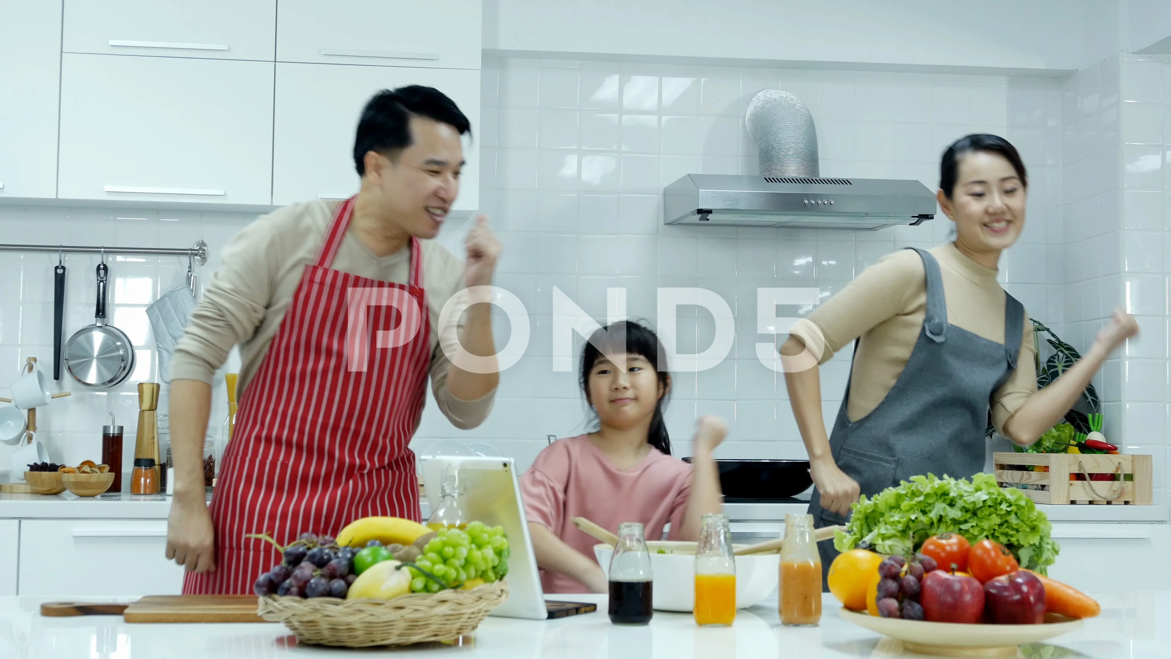 Asian family is cooking in the kitchen together