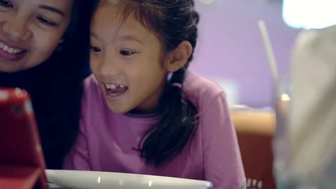 Asian family enjoy using computer tablet together, handheld dolly 4K Video stock 103066833