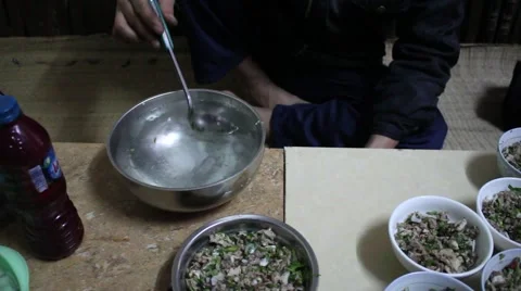 Asian farmers working in the kitchen, making traditional dishes Stock Footage 46460299