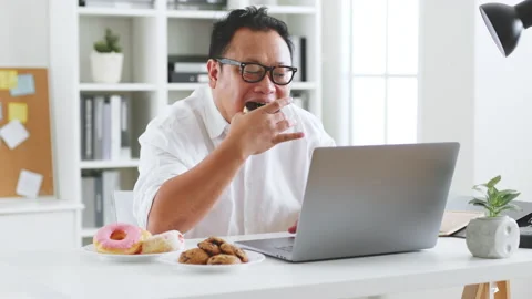 Asian fat man eating donut, sweet, junk ... | Stock Video | Pond5