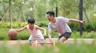 Asian Father &Amp; Son Playing Basketball In Garden In The Morning In Slow Motion Stock Footage