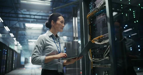 Asian Female Data Center Engineer Using Laptop Computer Video stock 319995659