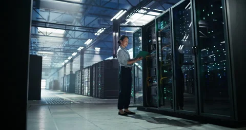Asian Female Data Center Engineer Using Laptop Computer Stock Footage 320000001