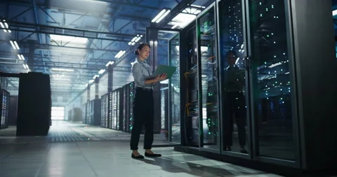 Asian Female Data Center Engineer Using Laptop Computer Stock Footage 320000049