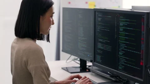 Asian Female Developer Focused on Programming Task. Stock Footage 310589374
