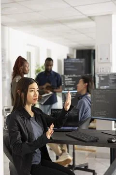 Asian Female Developer Using 3D Interface in Office Stock Photos