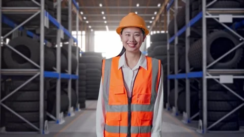 Asian Female Engineer Smiling To Camera at Tire Warehouse Stock Footage 341787936