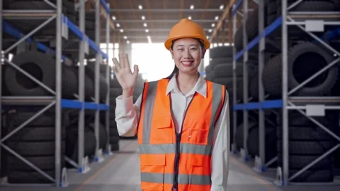 Asian Female Engineer Smiling To Camera Waving Hand Saying Bye Tire Warehouse Stock Footage 341787989