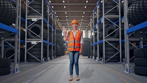 Asian Female Engineer Smiling To Camera Waving Hand Saying Bye Tire Warehouse Stock Footage 341789682