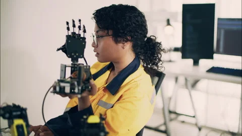 Asian Female Engineer Testing Robotic Hand Prototype in Modern Lab. Stock Footage 307586866