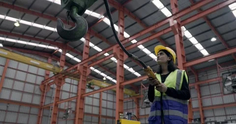 Asian female engineer using machine control tools factory. Stock Footage 308170412