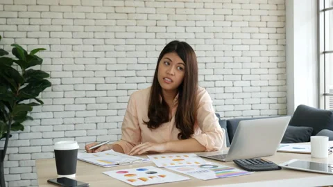 Asian Female freelance using laptop at home office desk 動画素材 270019087
