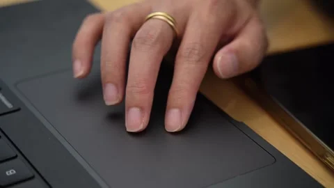 Asian female hand using a laptop touch pad searching for knowledge and inform Stock Footage 336419653