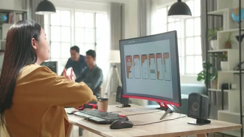 Asian Female Mobile Application Developer Stretching While Works With Graphics Stock Footage 158097997