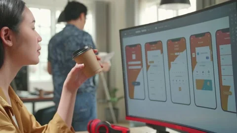 Asian Female Mobile Application Developer Works And Drinking Coffee Stock Footage 158102405