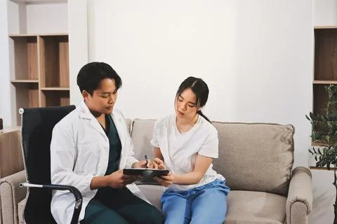 Asian female patient crying while consulting her health problem Stock Photos
