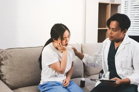 Asian female patient crying while consulting her health problem Stock Photos