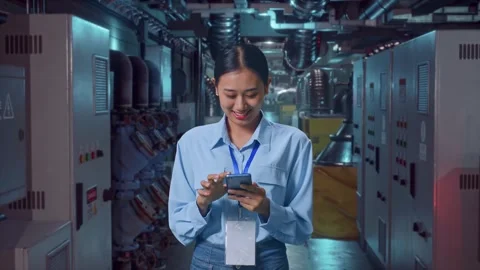 Asian Female Professional Worker Use Phone In Engine Control Room Stock Footage 292374712