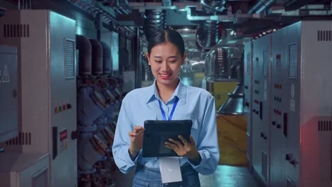 Asian Female Professional Worker Working With A Tablet In Engine Control Room Stock Footage 292374635