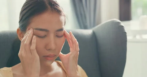 Asian female sit on sofa with computer laptop feel eyes tired take a rest. Stock Footage 203431927