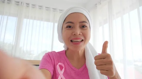 Asian female talking at camera cheering give empathy to breast cancer patient Stock Footage 149057063